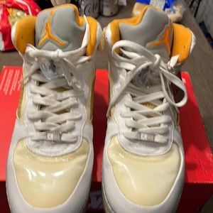 Nike Air Jordans- Size 12. Colors: Orange, yellow, and white. Lightly used.